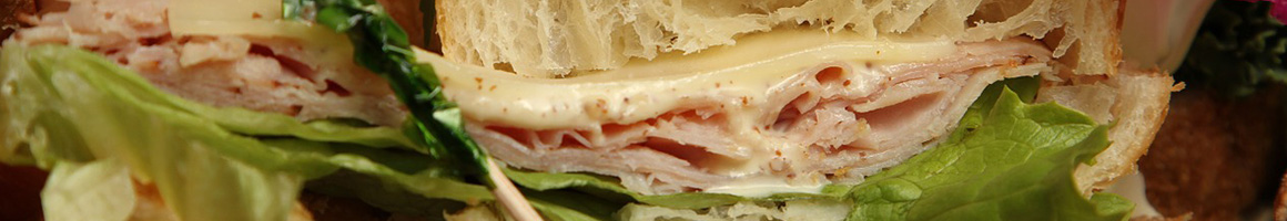 Eating Deli Sandwich at Sand Wedge Deli & Catering restaurant in Norwalk, CT.